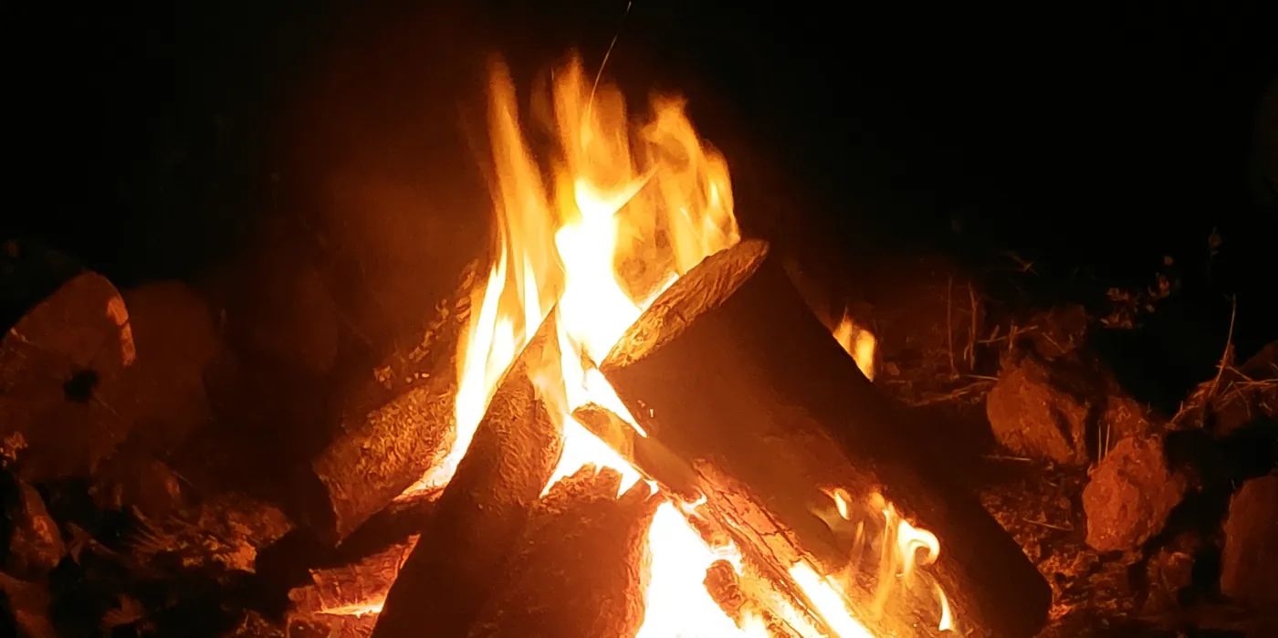 A campfire burning at night